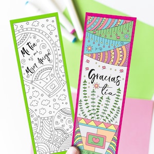 May include: Two printable bookmark designs with black and white line art. The first bookmark features a hot air balloon with the text "Mi Tia es mi Mejor Amiga". The second bookmark features a potted plant with the text "Gracias Tia".