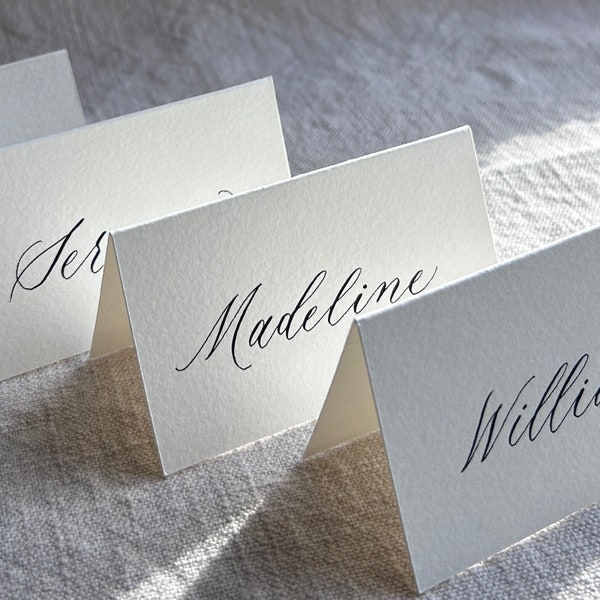 Modern calligraphy folded place cards lettered in black ink, hand-lettered place cards, name cards for weddings, parties and special events