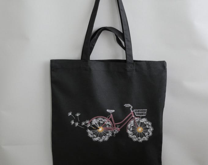 Flying white dandelions wheel pink bicycle