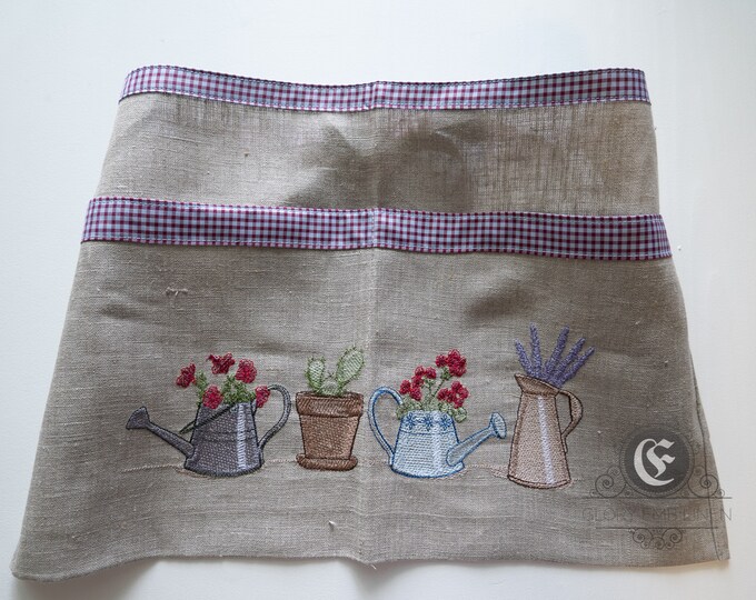 Short apron embroidered flowers in watering can