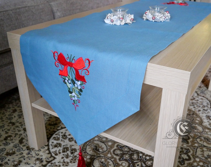 Table runner embroidered Christmas flag and red bow from natural blue linen fabric for Advent holiday farmhouse decoration