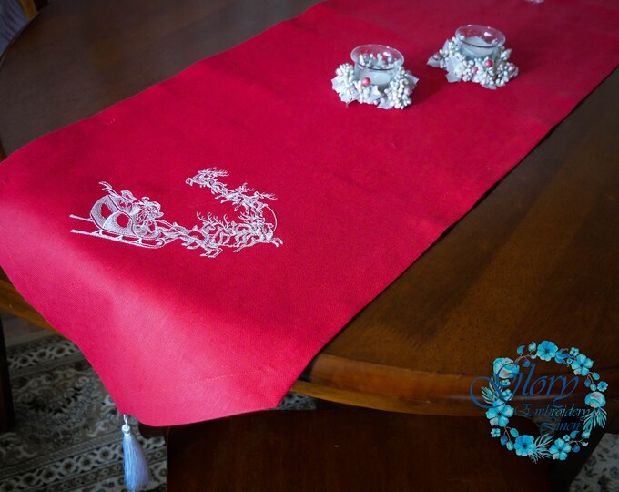 Christmas table runner with embroidered Santa made of natural organic linen fabric in red with white tassels