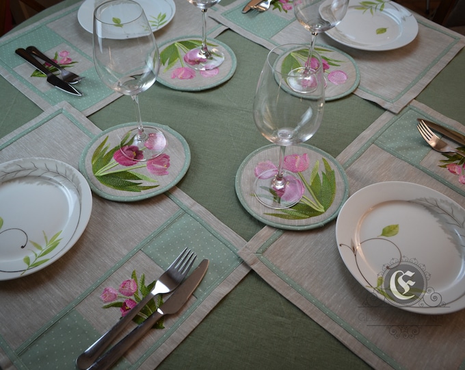 Set of table linen include circle embroidered tablecloth, 4 placemats with embroidery and 4 round embroidered coasters for glasses