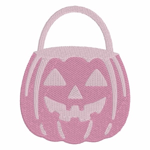May include: A pink embroidered Halloween pumpkin basket with a handle. The pumpkin has a carved face with triangular eyes and a toothy grin. The design features white accents and is set against a white background.