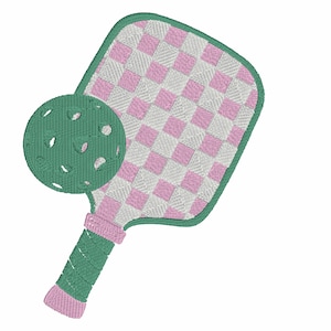 May include: An embroidered pickleball paddle and ball. The paddle has a pink and white checkered design on the face, a green border, and a pink and green handle. The ball is green with several holes.