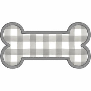 May include: A dog bone-shaped design featuring a gray and white gingham pattern. The bone has a gray stitched border. Suitable for pet-themed crafts and accessories.