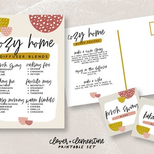 Può includere: Set stampabile di schede di ricette per miscele di diffusori con un tema di casa accogliente. Le schede presentano uno sfondo marrone chiaro con forme astratte rosa e gialle. Il testo include i nomi delle miscele: "porch swing", "crackling fire", "baking pie", "favorite mug", "early morning", e "warm blankets". Le miscele sono elencate con gli ingredienti di oli essenziali. Il retro della scheda include istruzioni per realizzare uno spray per ambienti, una miscela per diffusore e un rullo.