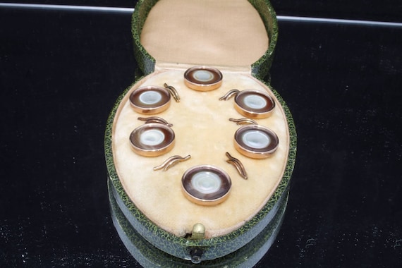 Antique boxed Iridescent Gold coloured Button set.