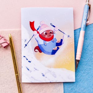 Biglietto di auguri invernale con gatto sciatore carino - Biglietto di auguri fatto a mano, illustrazione di animali stravaganti per gli amanti dei gatti, biglietto di Natale