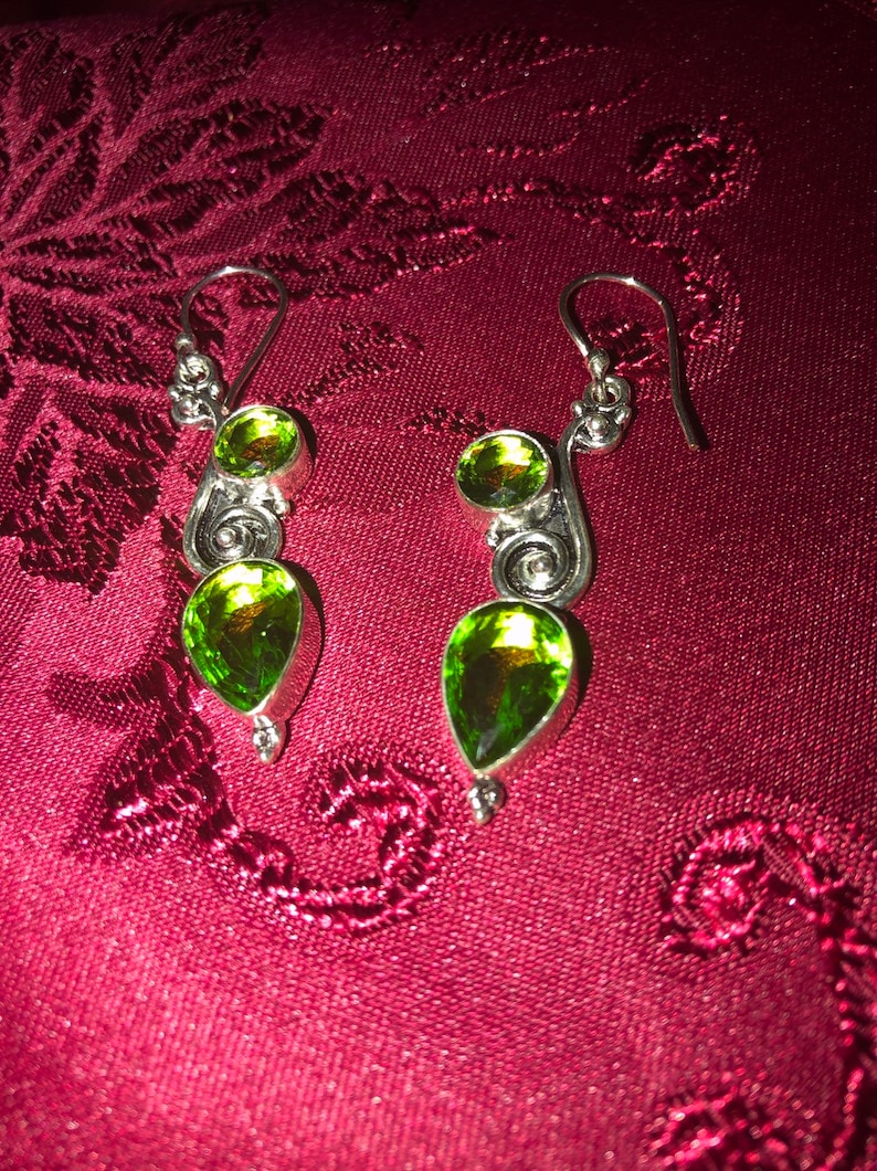 Green Peridot set in 925 silver These beauties are 2.15 long