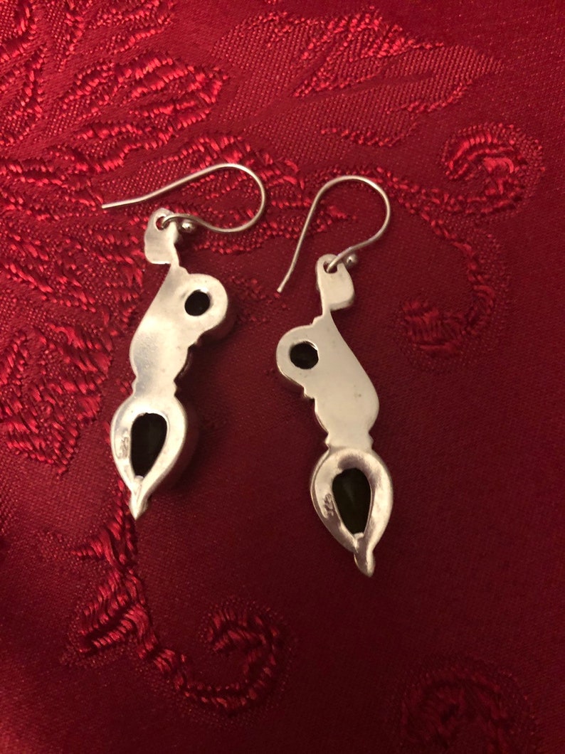 Green Peridot set in 925 silver These beauties are 2.15 long