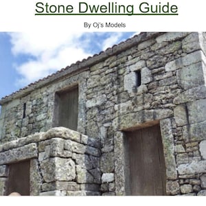 Könnte beinhalten: Modell eines Steinhauses mit dem Text "Stone Dwelling Guide" und "By Oj's Models". Das Gebäude hat eine verwitterte Steinfassade, Holztüren und kleine Fenster vor einem bewölkten Himmel.