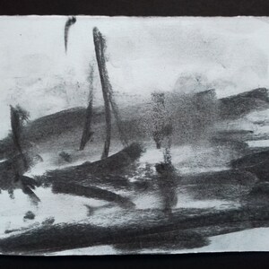 May include: Abstract charcoal drawing on white paper with dark gray and black brushstrokes.