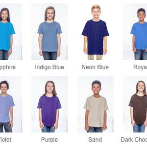 May include: A color chart of t-shirt colors for kids. The colors include tropical blue, sapphire, indigo blue, neon blue, royal, heather navy, navy, violet, purple, sand, dark chocolate, and black.