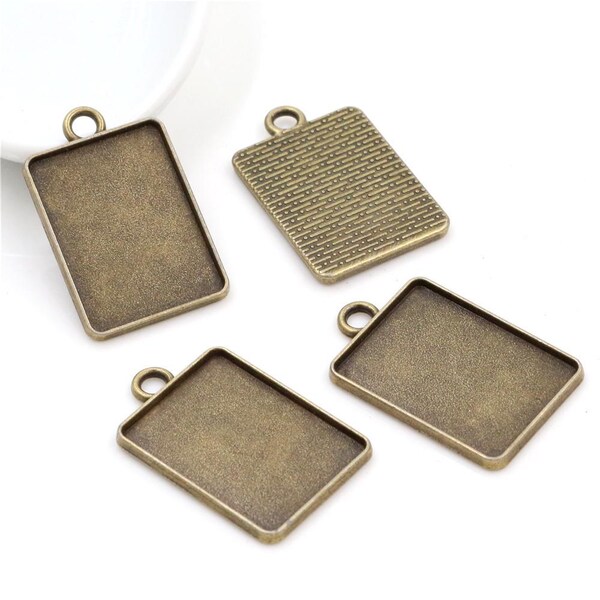 20 piezas de bandejas colgantes rectangulares de tono plateado antiguo/bronce antiguo, bases colgantes en blanco, ajustes de colgante de bisel para vidrio/pegatinas de 18 mm x 25 mm