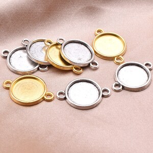 May include: A set of round metal bezel settings with two jump rings. The bezels are available in silver and gold tones.