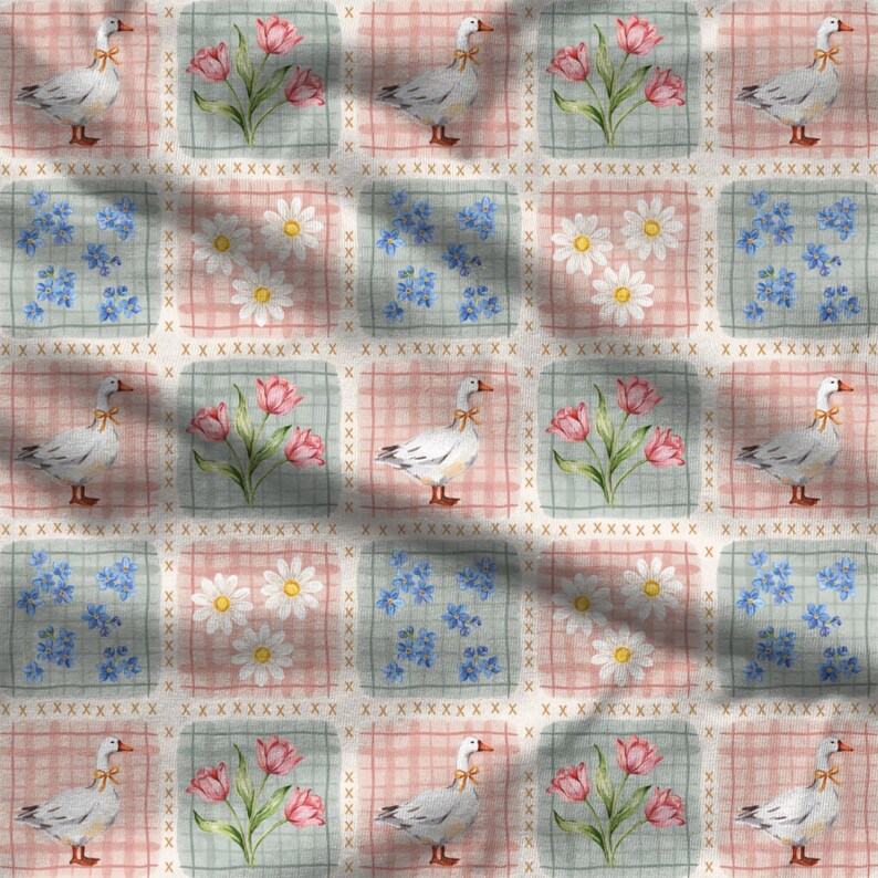 May include: A fabric pattern featuring a repeating grid of squares. The squares alternate between white geese with orange beaks wearing orange ribbons, pink tulips, white daisies, and small blue flowers, all set against a pink plaid background.