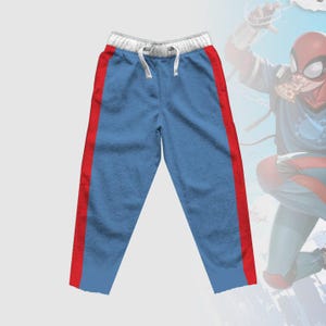May include: Blue sweatpants with red side stripes and a white waistband.