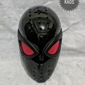 May include: A glossy black mask with red eye lenses and numerous ventilation holes. The mask has a sleek, aerodynamic design, and the text "IWAN ZONA KAOS" is visible on the upper right corner. This mask is likely for cosplay or costume use.