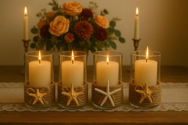 May include: Four cylindrical glass candle holders, each containing a white pillar candle. The base of every glass is wrapped in thick tan rope, decorated with a small, light-colored starfish figure. Two tall taper candles stand in the background.