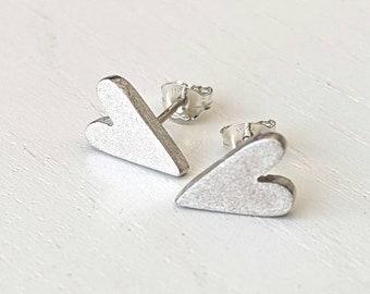 Chunky silver heart studs earrings.