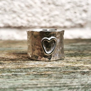 A lovely and simple chunky, wide silver ring.