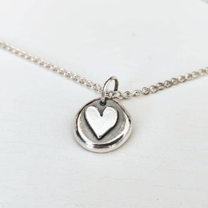 Silver heart pebble necklace.