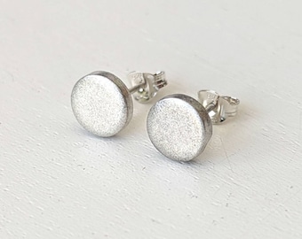 Chunky silver disc stud earrings.