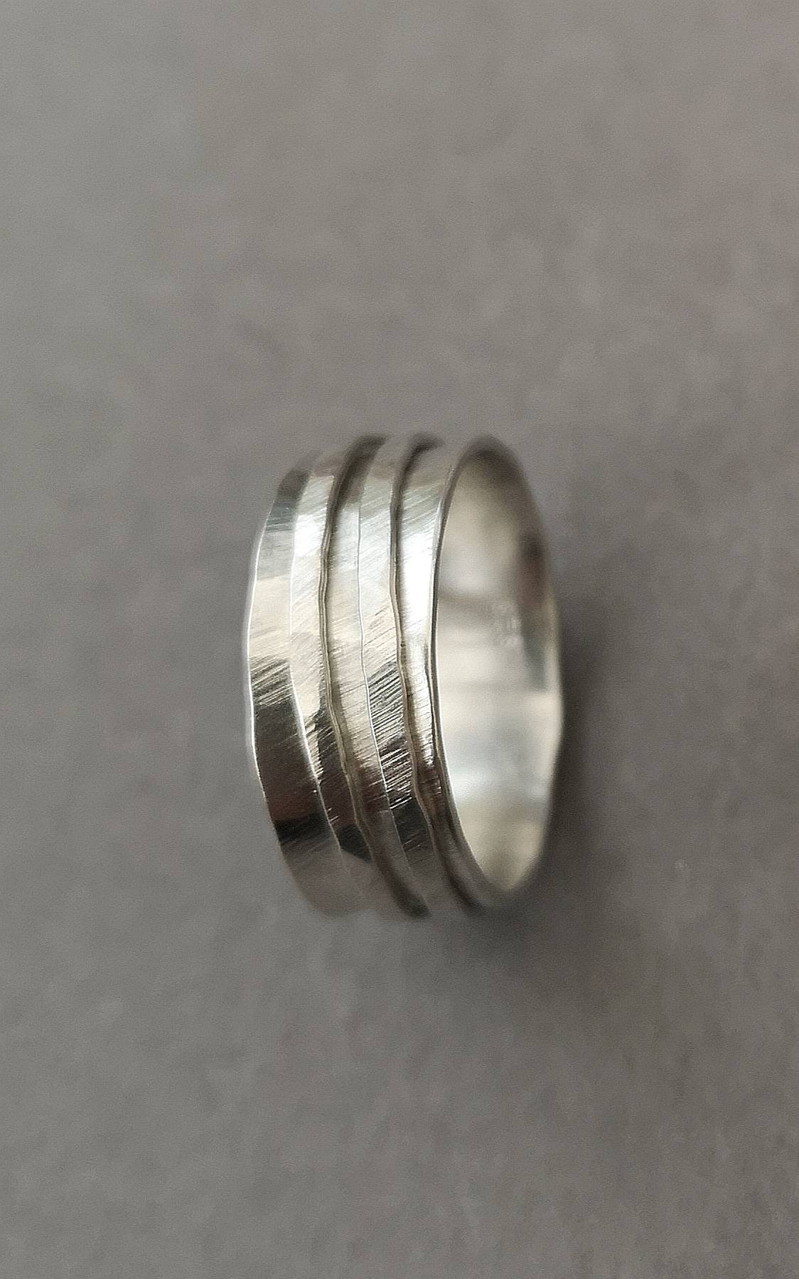 A wonky silver spinner ring.