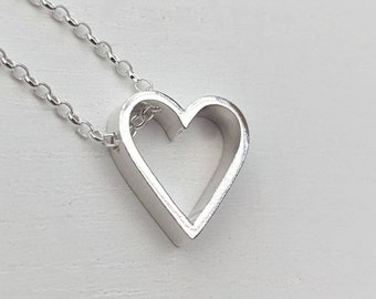 A small but chunky heart pendant necklace.