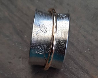 A gorgeous textured and Dandelion stamped silver ring with a Gold Filled Spinner.