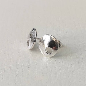 Hammered silver studs.