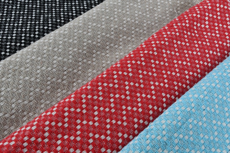 May include: Four fabric swatches with a checkered pattern. The swatches are black and white, beige, red and white, and light blue and white.