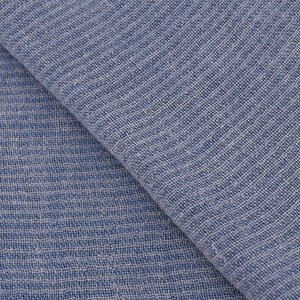 May include: Close-up of a light blue fabric with a textured weave. The fabric has a subtle sheen and a soft, drapey feel.