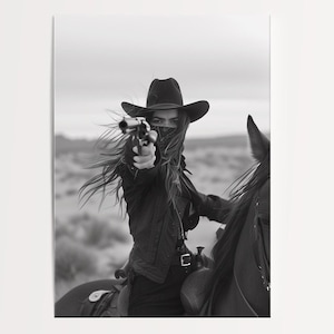 Black and white photograph of a cowgirl on horseback aiming a revolver in the desert.