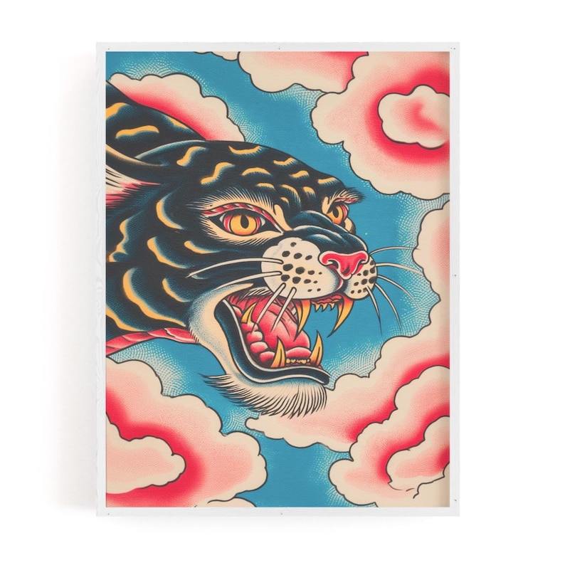May include: A framed art print featuring a black panther head with yellow eyes and an open mouth showing sharp teeth. The panther is surrounded by stylized pink clouds against a blue background with a stippled texture throughout the illustration.