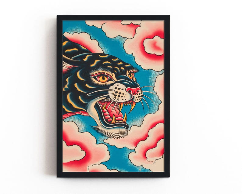 May include: A framed art print featuring a black panther head with yellow eyes and an open mouth showing teeth, set against a blue background with stylized pink and white clouds. The illustration uses bold lines and vibrant colors in a tattoo style.