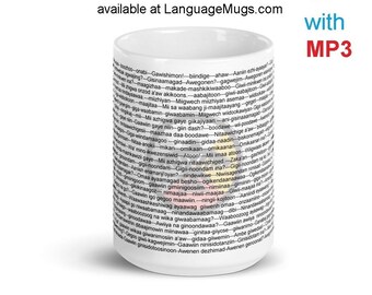 May include: White ceramic mug with a black and gray design featuring Anishinaabemowin phrases. The mug is available at LanguageMugs.com and includes an MP3 companion with Ojibwe and English translations.