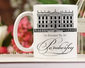 May include: White ceramic mug with a black and white illustration of a large house and the text "I'd Rather Be At Pemberley".
