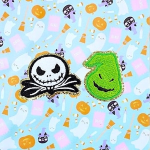May include: Two embroidered iron-on patches featuring characters from The Nightmare Before Christmas. The patch on the left is black and white and features Jack Skellington. The patch on the right is green and features the character of Oogie Boogie.