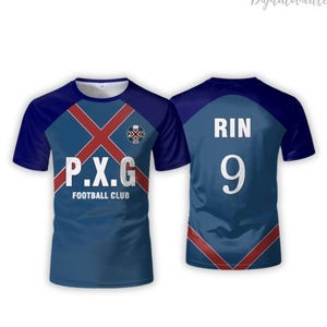 May include: A blue and navy short-sleeved football club jersey. The front features the text "P.X.G FOOTBALL CLUB" in white, with a red cross design. The back displays "RIN" and the number "9" in white. A logo is visible on the front.