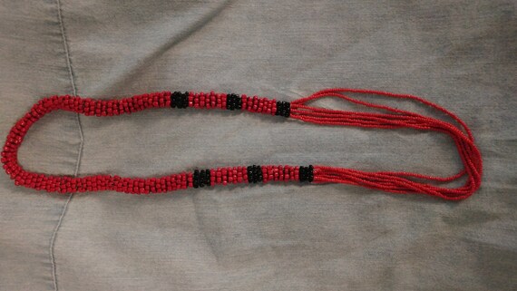 Snake patterned beaded tube style necklace appeara