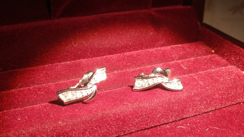 Abstract Rhinestone Signed silver tone ribbon earrings clip on