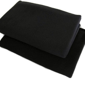May include: Two black fleece blankets folded on top of each other.