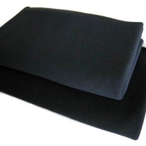 May include: Two black fleece blankets folded on top of each other.