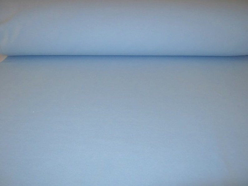 May include: A roll of light blue fabric.