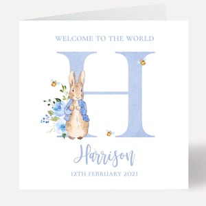 May include: A blue and white baby shower card with a watercolor illustration of Peter Rabbit and the letter H. The card says "Welcome to the world Harrison 12th February 2021".