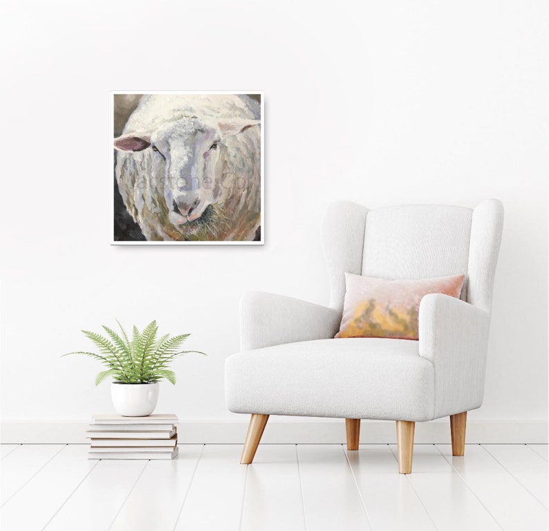 May include: A close-up painting of a white sheep's face. The sheep has a soft, fluffy coat and is looking directly at the viewer. The painting is done in a realistic style and captures the sheep's gentle expression.