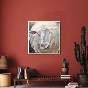 May include: A close-up painting of a white sheep with a soft, fluffy coat. The sheep's face is looking directly at the viewer with a gentle expression. The painting is done in a realistic style with subtle brushstrokes.