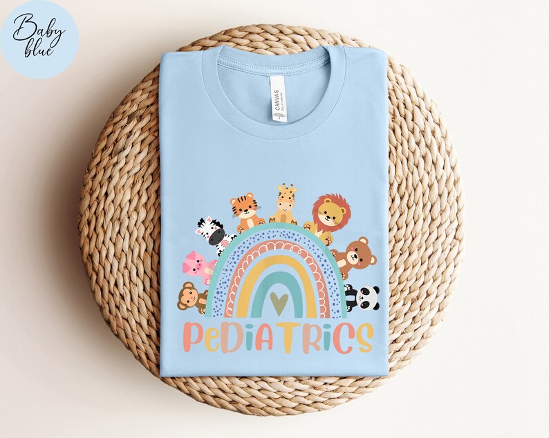 May include: Light blue t-shirt with a rainbow and animals, the text "PEDIATRICS" is below the rainbow.